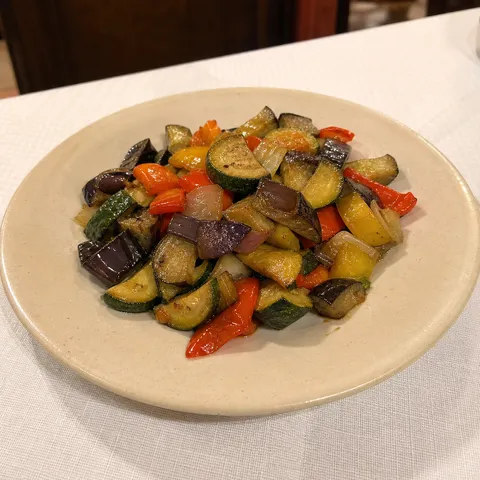 Mixed vegetables sautéed in a pan.